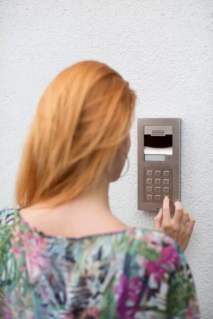 Woman using intercom